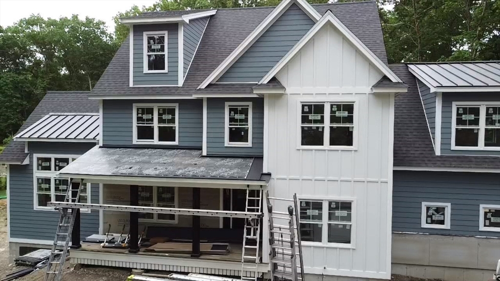 104 King George Drive Boxford, MA 01921 - Photo 16 of 19 a front view of a house with a yard
