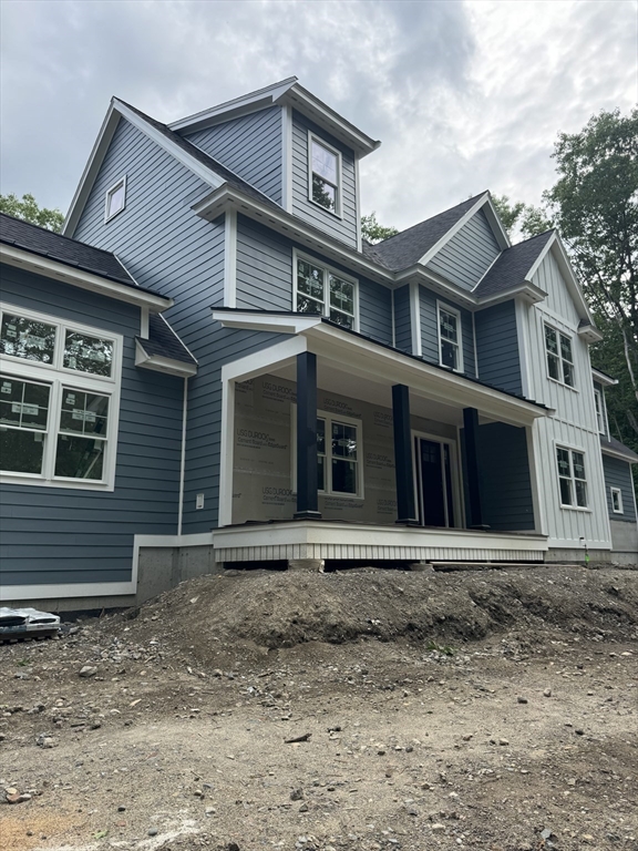 104 King George Drive Boxford, MA 01921 - Photo 4 of 19 a front view of a house with a yard