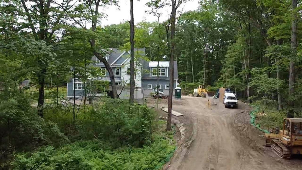 104 King George Drive Boxford, MA 01921 - Photo 9 of 19 a house view with a sitting space and garden space