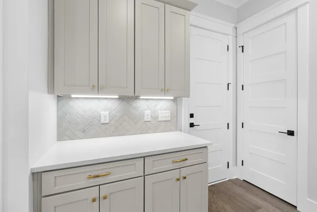 a view of cabinets and wooden floor