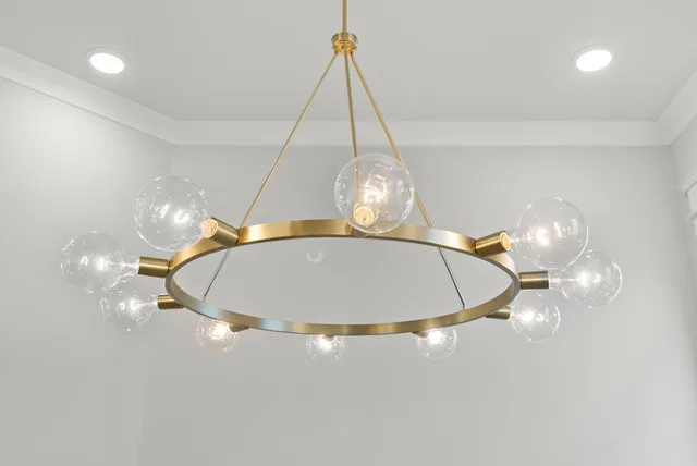 a bathroom with a granite countertop toilet a sink and a mirror