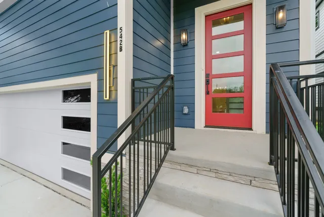 a view of a kitchen with a sink cabinetry wooden floor and chandelier
