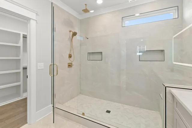 a view of a balcony with wooden floor and fence