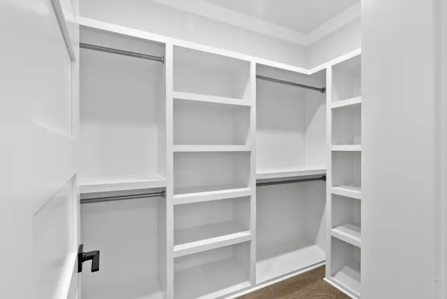 a view of a house with backyard and a fence