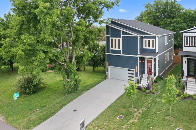 a view of a room with wooden floor and windows