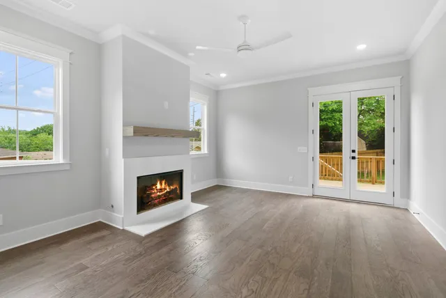 a view of a kitchen with a fireplace wooden floor and a window