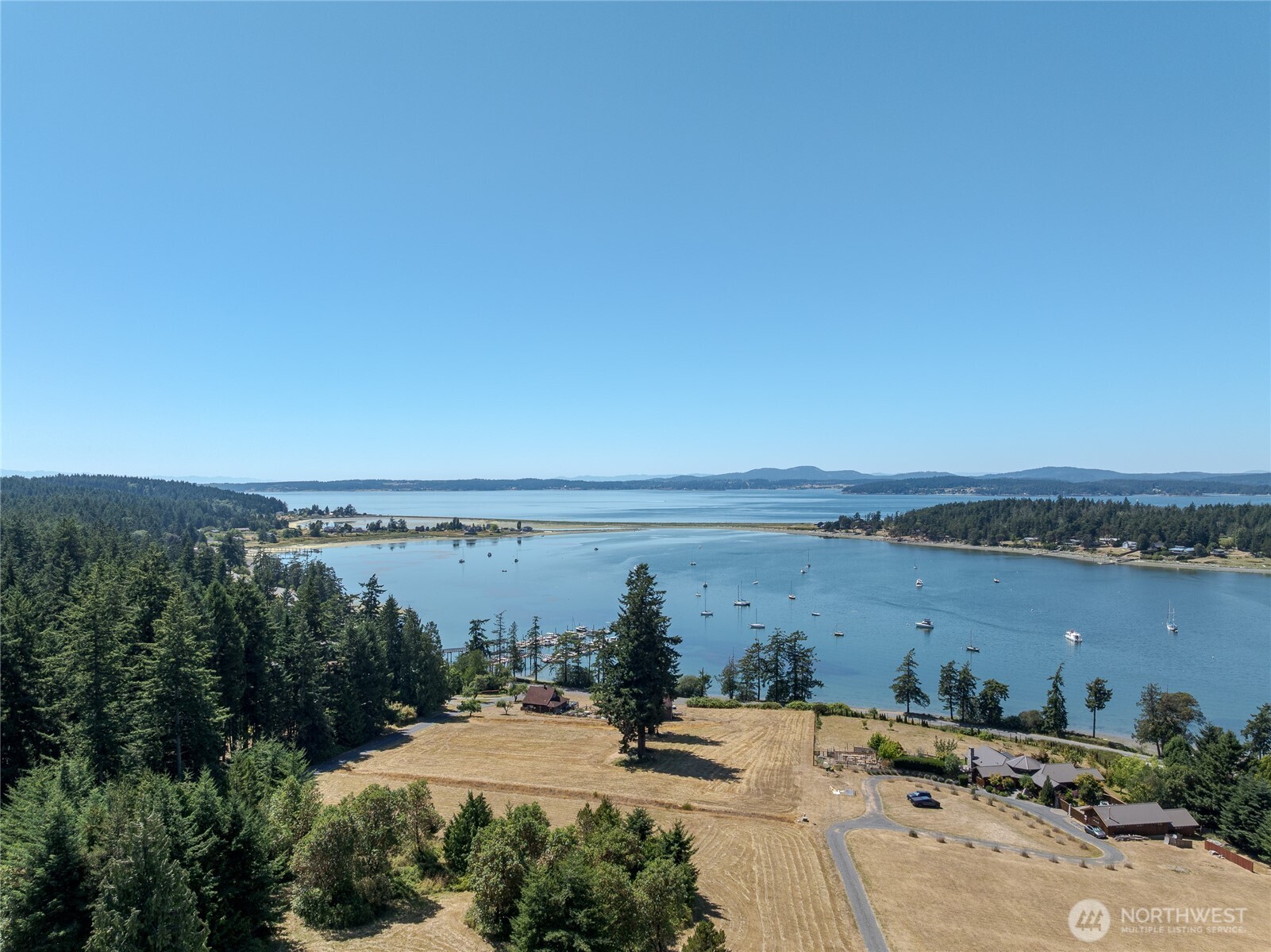 295 Rum Runner Road Lopez Island, WA 98261 - Photo 16 of 37 a view of a lake and mountain in back
