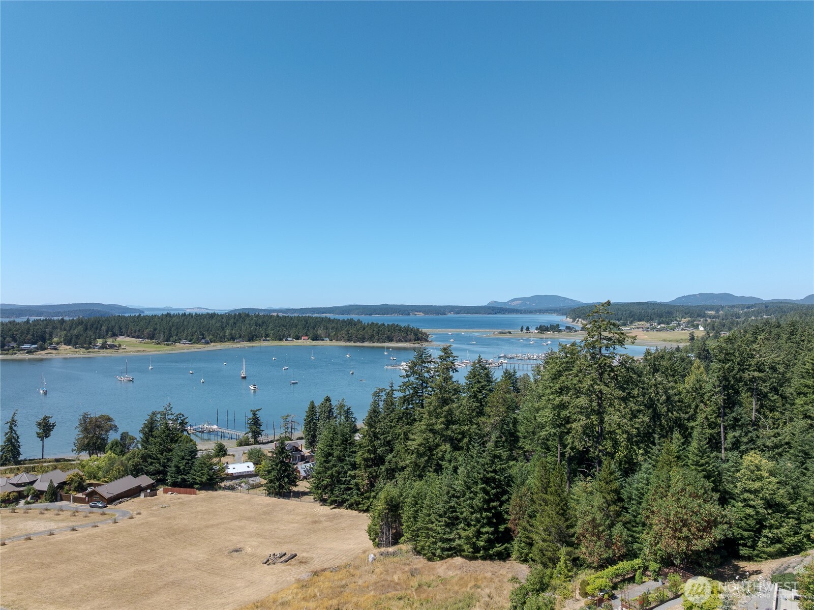 295 Rum Runner Road Lopez Island, WA 98261 - Photo 18 of 37 a view of a lake with mountain in the background