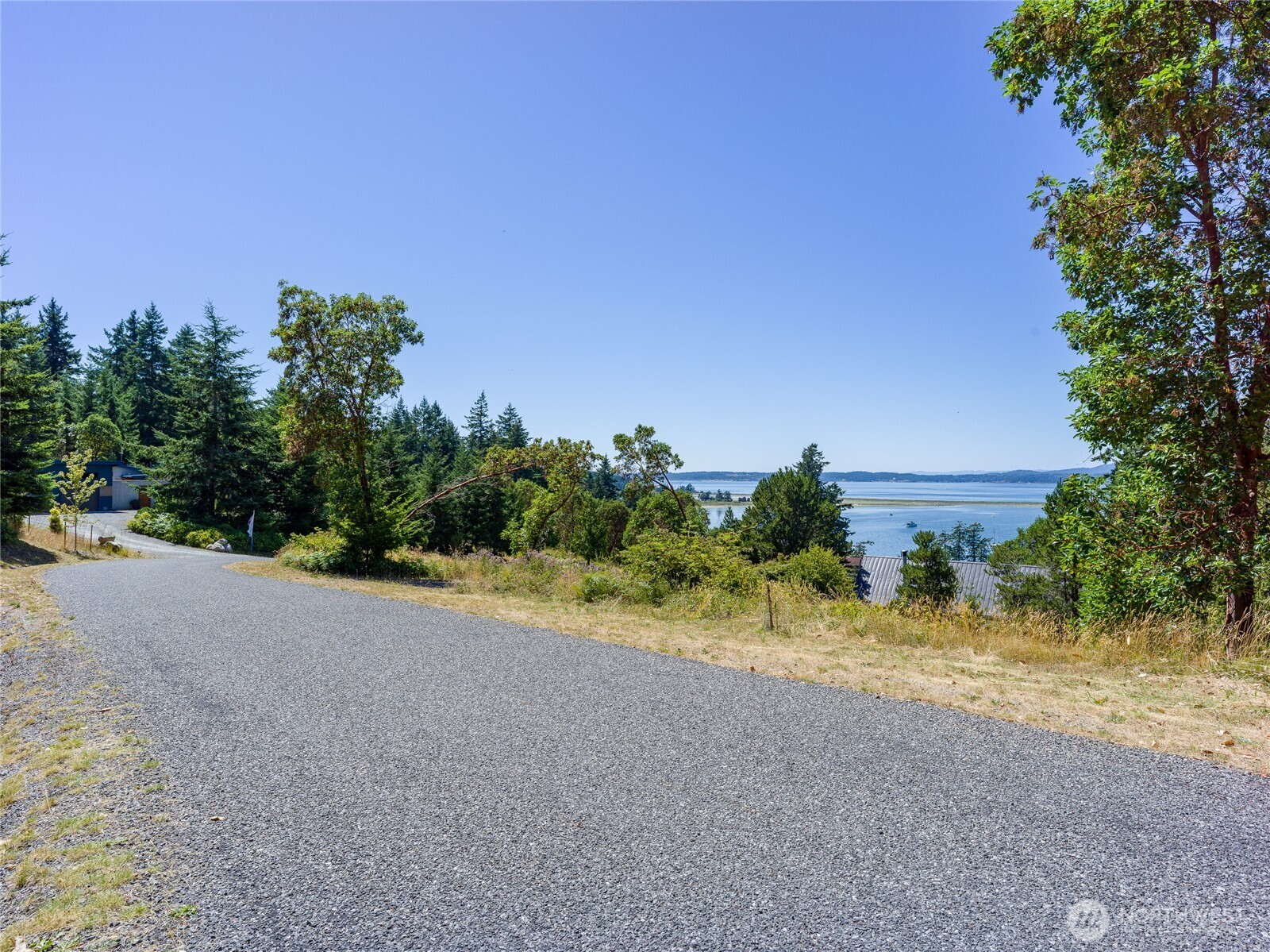 295 Rum Runner Road Lopez Island, WA 98261 - Photo 36 of 37 a view of a road with a yard