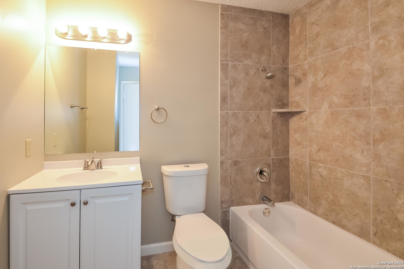 8007 Manderly Place Converse, TX 78109 - Photo 13 of 15 a bathroom with a sink toilet and shower