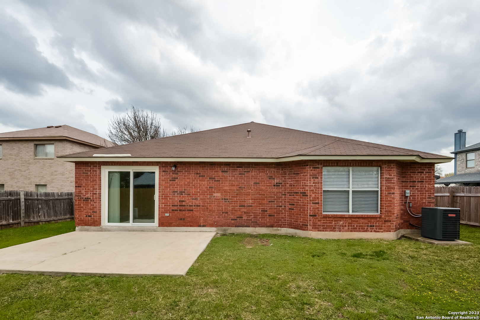 8007 Manderly Place Converse, TX 78109 - Photo 14 of 15 a front view of a house with garden