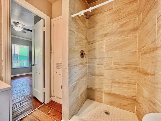 a bathroom with a bathtub and shower