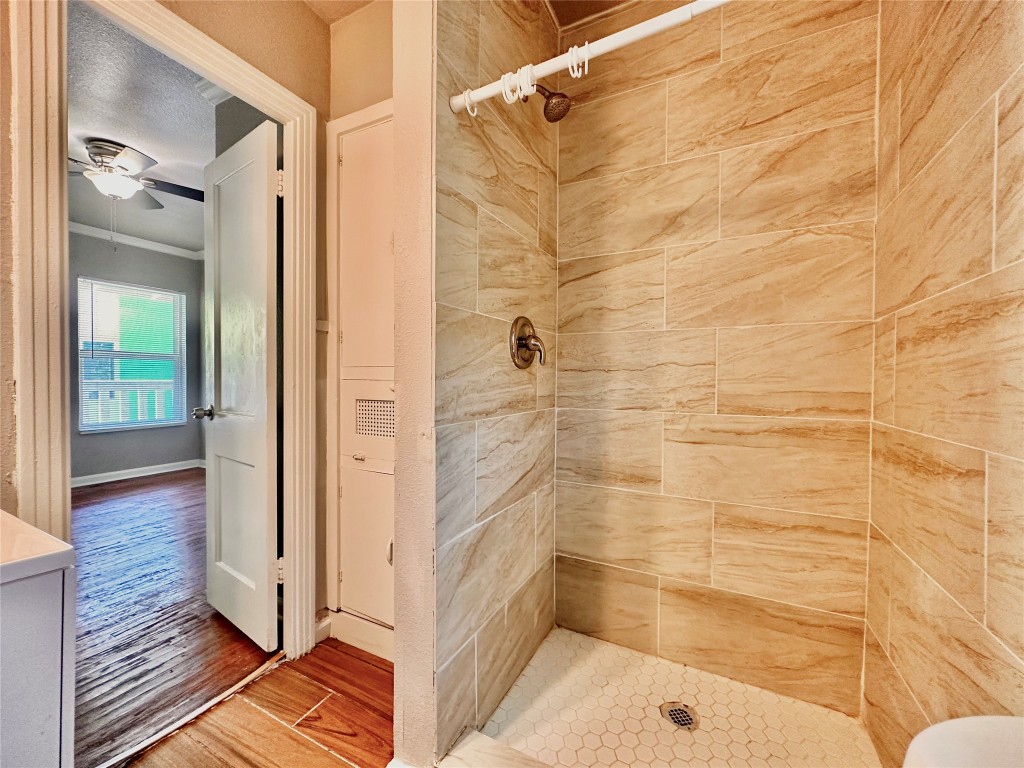 204 East 30th Street, Unit 101 Austin, TX 78705 - Photo 6 of 7 a bathroom with a bathtub and shower
