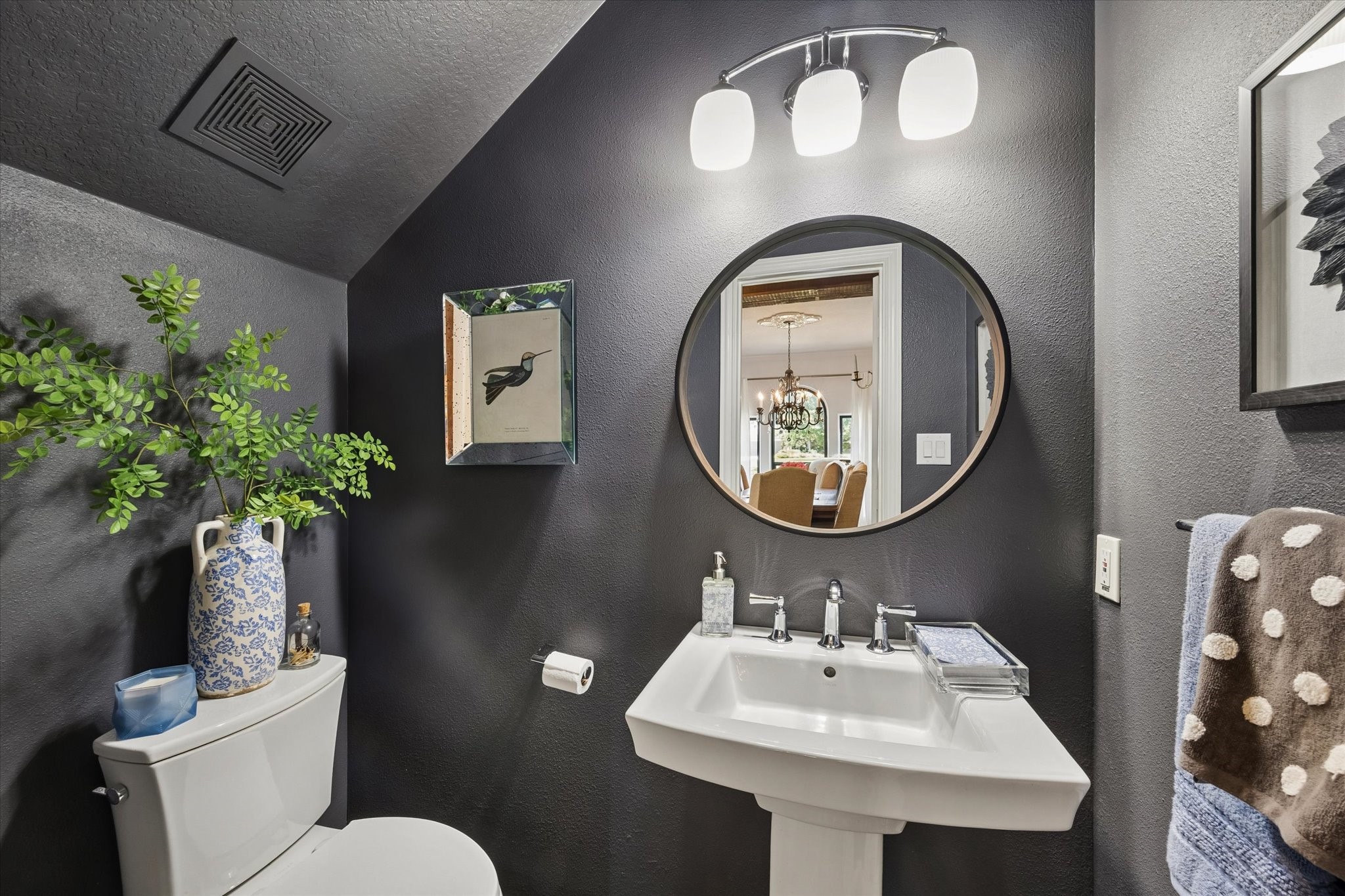 6819 Still Meadow Street Spring, TX 77389 - Photo 27 of 50 The chic powder room with modern pedestal sink is conveniently located off of the dining room and kitchen area