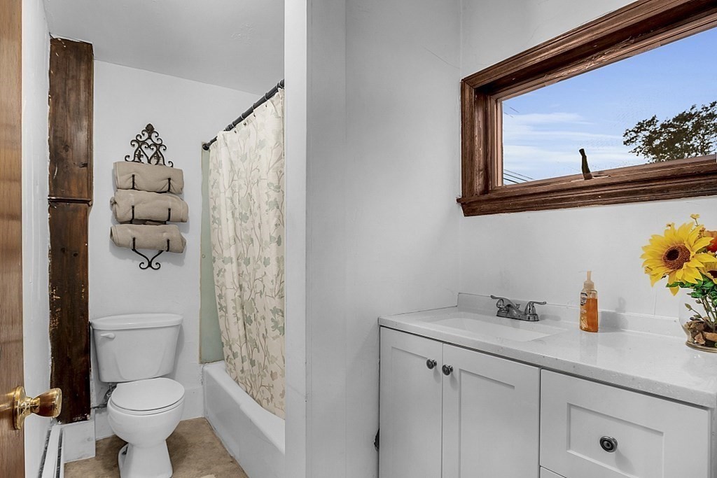 271 Broadway Haverhill, MA 01832 - Photo 11 of 26 a bathroom with a sink a toilet and shower