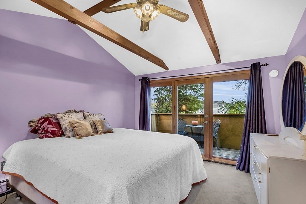 271 Broadway Haverhill, MA 01832 - Photo 18 of 26 a bedroom with a large bed and a large window