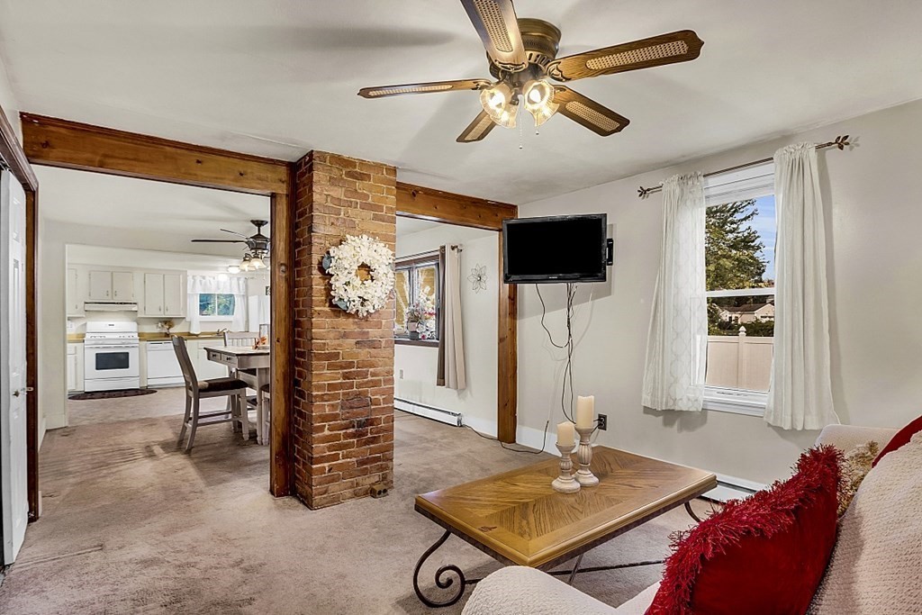271 Broadway Haverhill, MA 01832 - Photo 2 of 26 a living room with furniture and a table