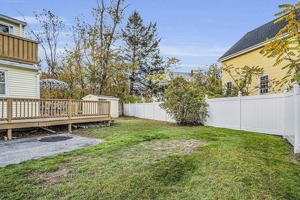 271 Broadway Haverhill, MA 01832 - Photo 21 of 26 a view of a backyard with a garden and deck