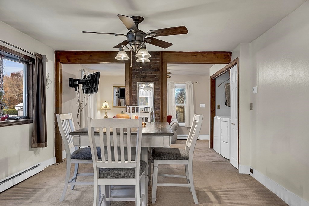 271 Broadway Haverhill, MA 01832 - Photo 6 of 26 a view of a dining room with furniture and a chandelier