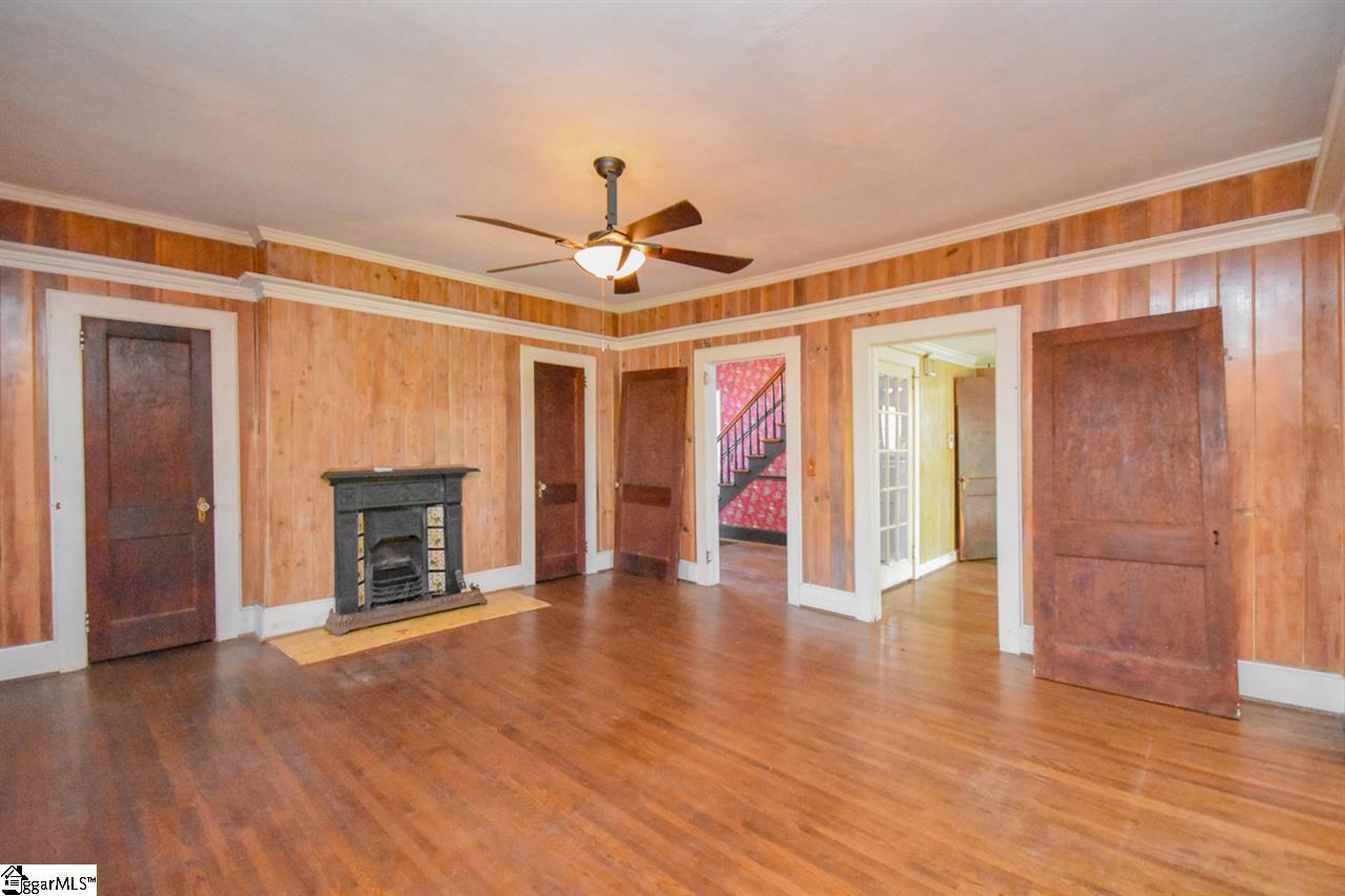 301 North Main Street Fountain Inn, SC 29644 - Photo 33 of 34 This is labeled Den on the Floor plan I would say that or Family room, it is a large room at 18X16..