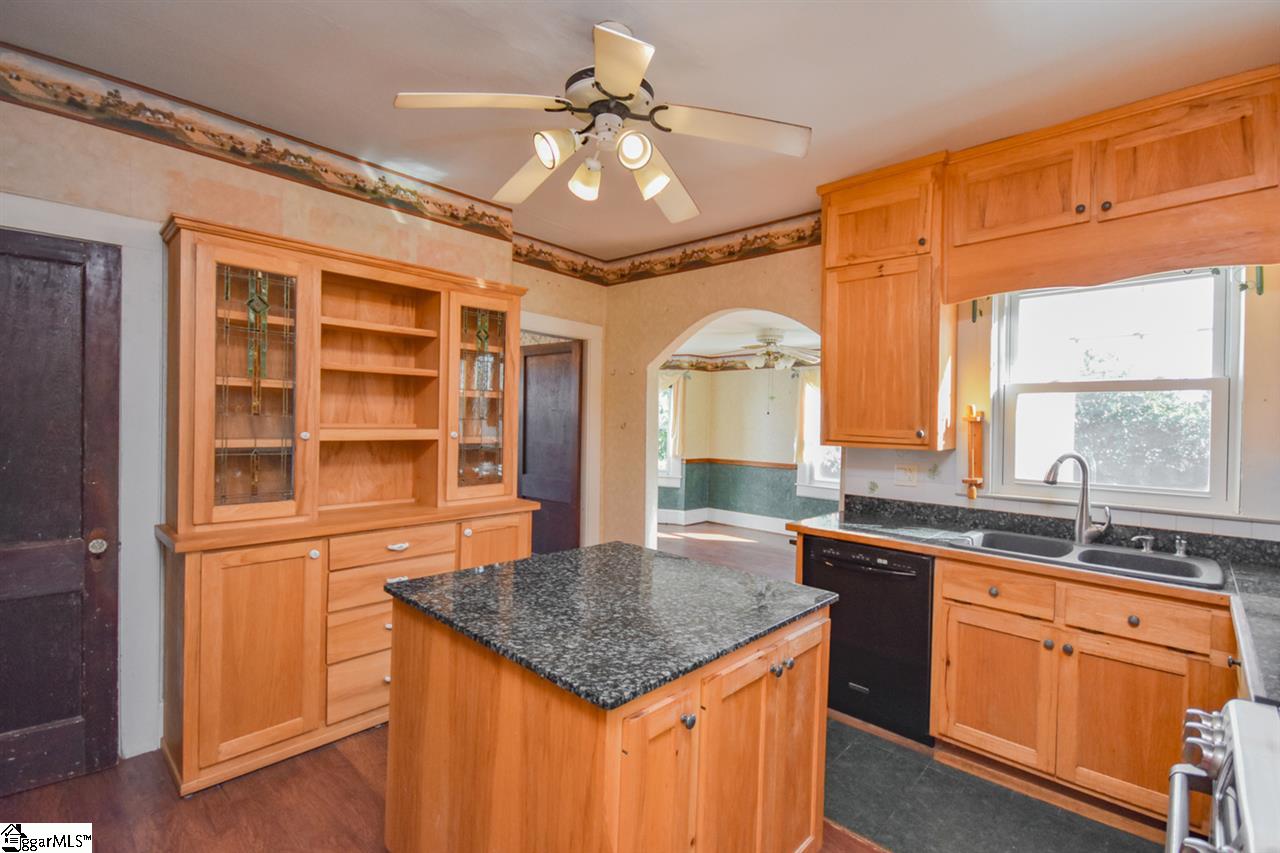 301 North Main Street Fountain Inn, SC 29644 - Photo 8 of 34 Center Island is moveable, for installation of Appliances, cleaning, has Electric running to it, and cubby for Wine Cooler, or Small Fridge...