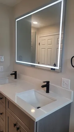 a bathroom with a sink and a mirror