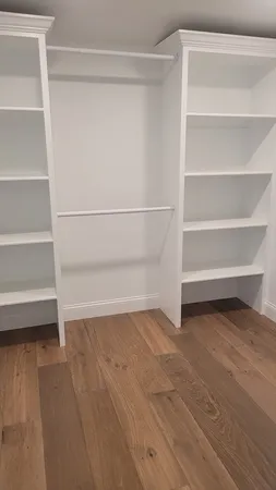 a view of an empty walk in closet