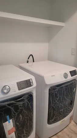 a utility room with dryer and washer