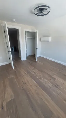 a view of a livingroom with wooden floor