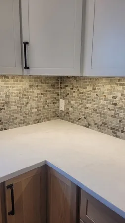 a kitchen with a sink and cabinets