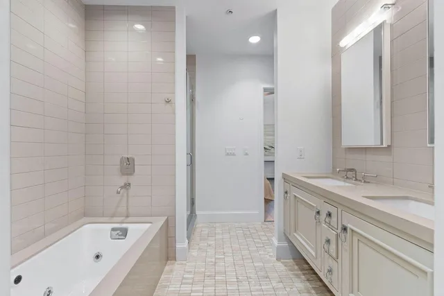 a bathroom with a bathtub and shower