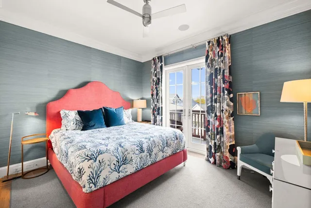 a bedroom with a bed and flat screen tv