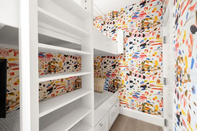 a balcony view with a large window and wooden floor