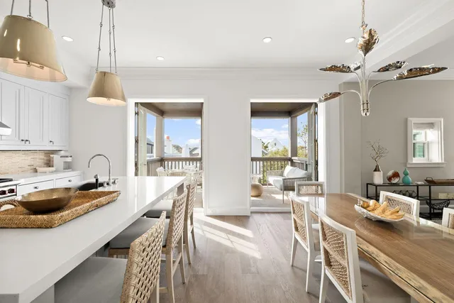 a kitchen with a stove a refrigerator and a table
