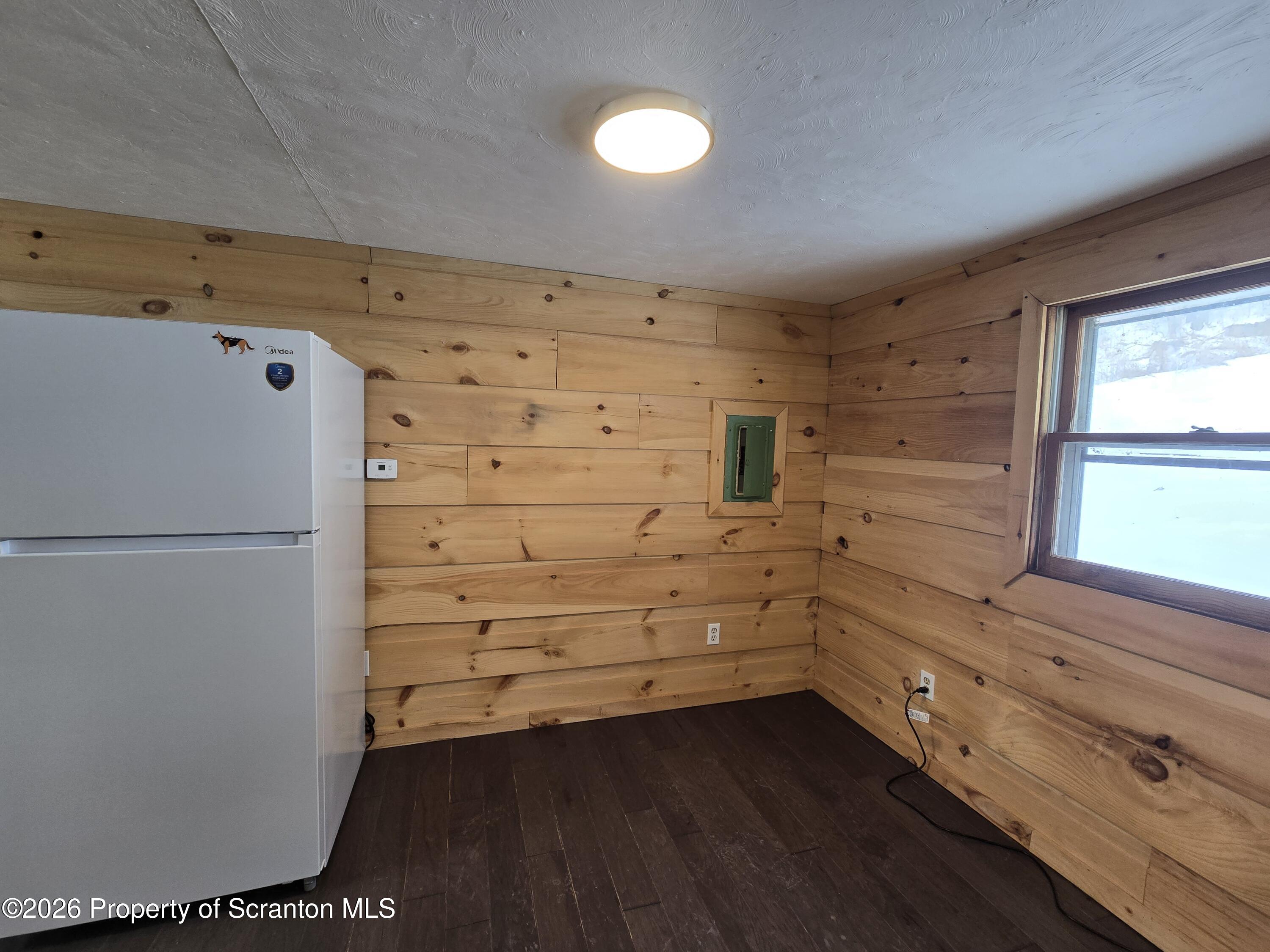 483 Turnpike Street Susquehanna, PA 18847 - Photo 17 of 27 a view of walk in closet with hardwood
