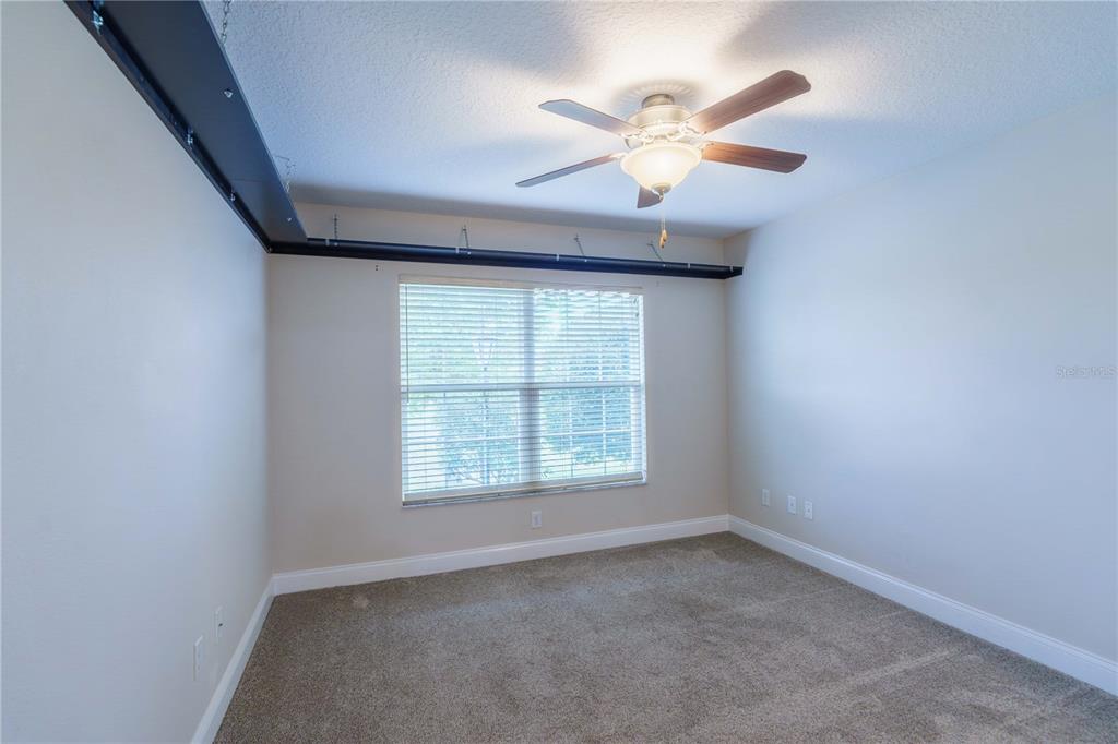 5273 Southwest 96th Place Ocala, FL 34476 - Photo 38 of 55 an empty room with a window and a fan