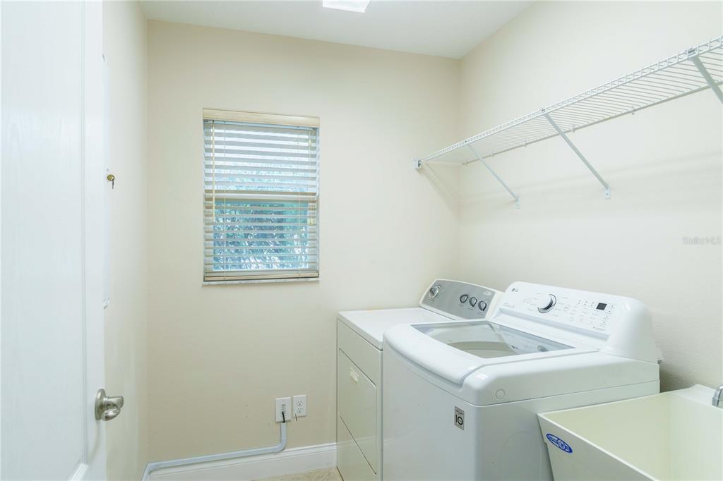 5273 Southwest 96th Place Ocala, FL 34476 - Photo 45 of 55 a utility room with dryer and washer