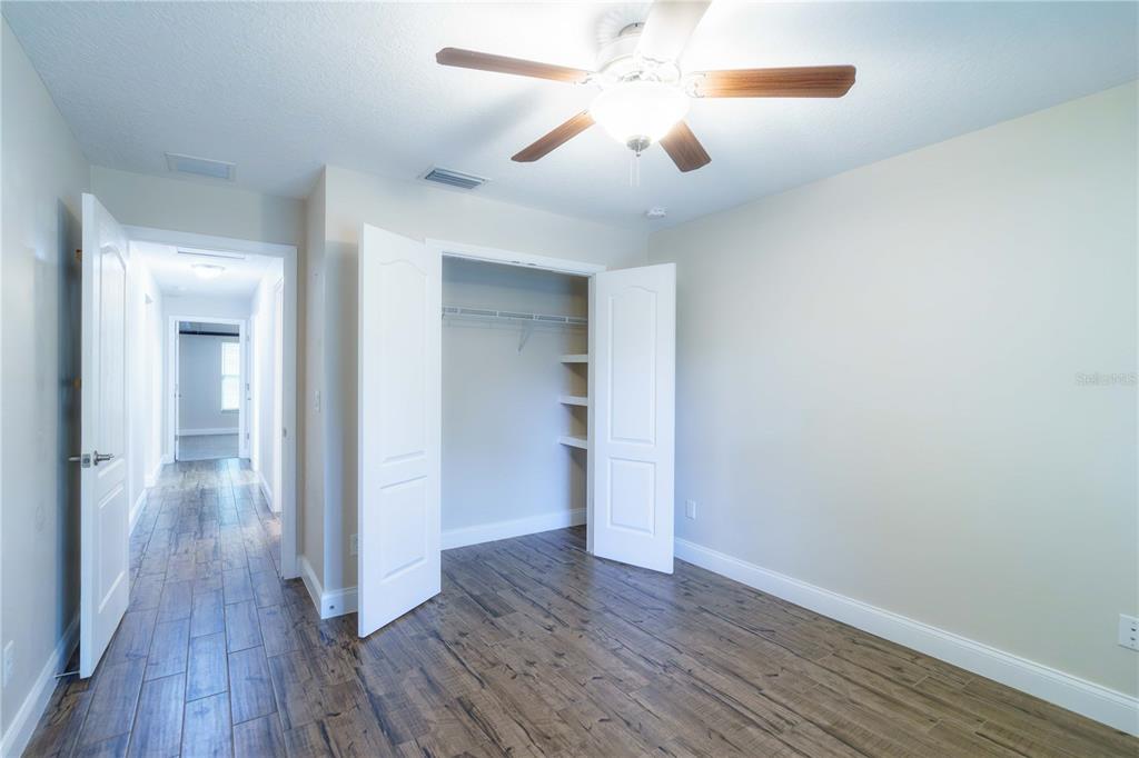 5273 Southwest 96th Place Ocala, FL 34476 - Photo 48 of 55 wooden floor in an empty room with a window