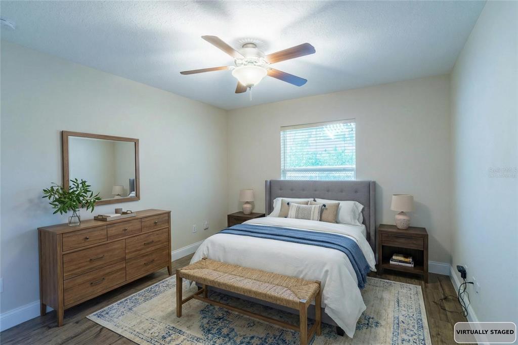 5273 Southwest 96th Place Ocala, FL 34476 - Photo 51 of 55 a bedroom with a bed and a dresser