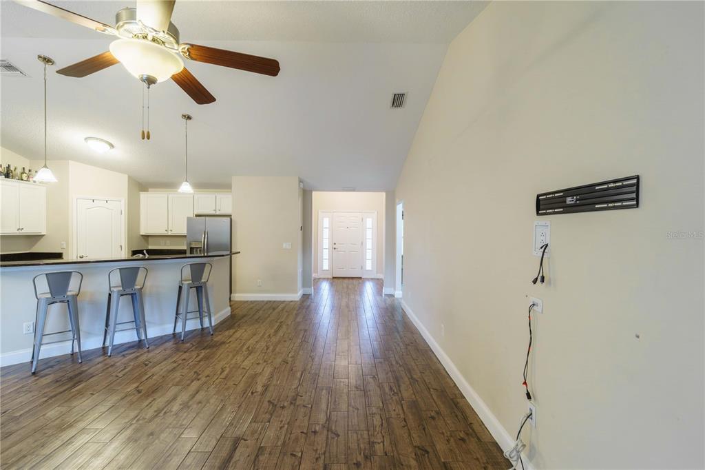 5273 Southwest 96th Place Ocala, FL 34476 - Photo 7 of 55 a view of kitchen with cabinets and wooden floor