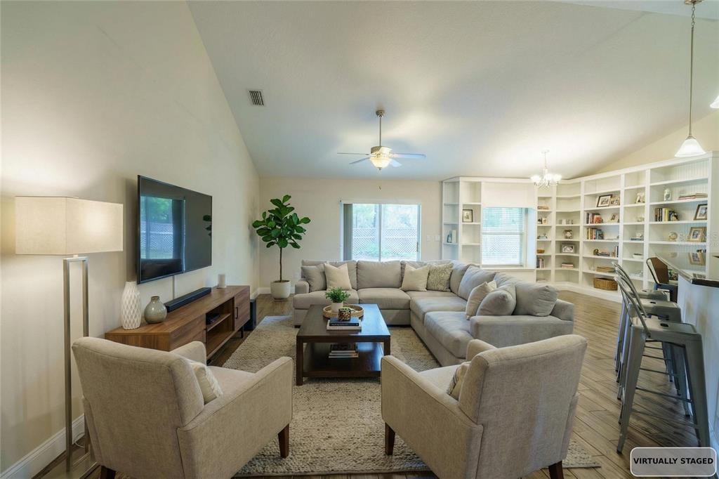 5273 Southwest 96th Place Ocala, FL 34476 - Photo 9 of 55 a living room with furniture and a large window