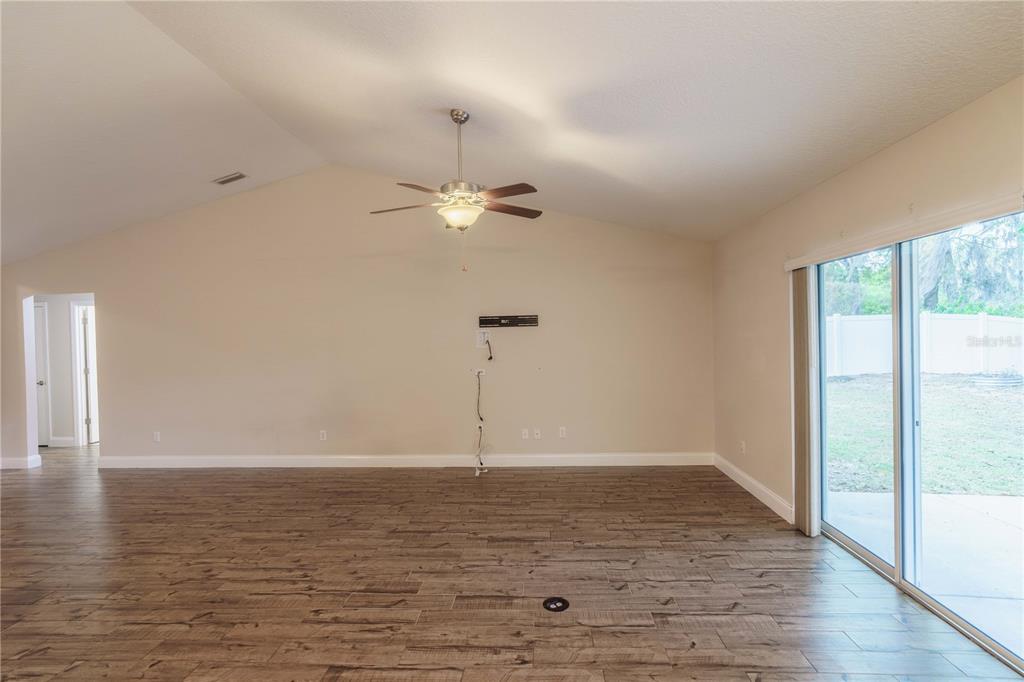 5273 Southwest 96th Place Ocala, FL 34476 - Photo 10 of 55 a view of a room with wooden floor