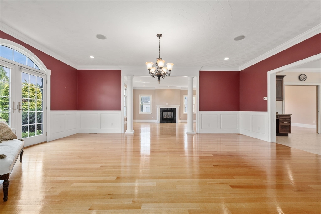 19 Cherokee Road Canton, MA 02021 - Photo 11 of 42 a large room with chandelier and wooden floor