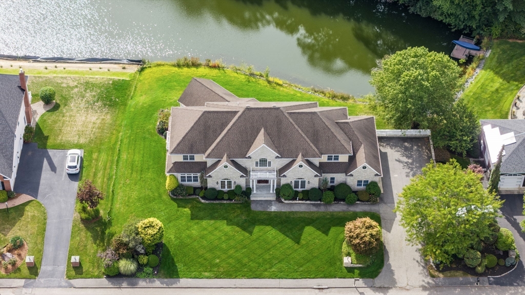 19 Cherokee Road Canton, MA 02021 - Photo 2 of 42 an aerial view of a house with a garden and swimming pool