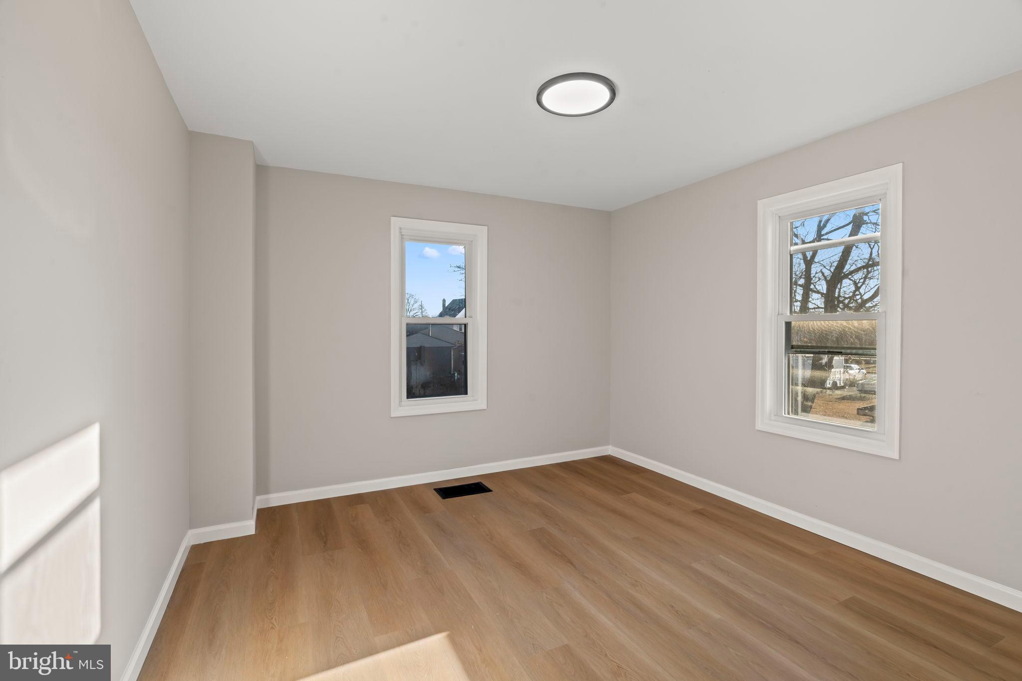 606 Spruce Street Delanco, NJ 08075 - Photo 15 of 29 wooden floor in an empty room with a window