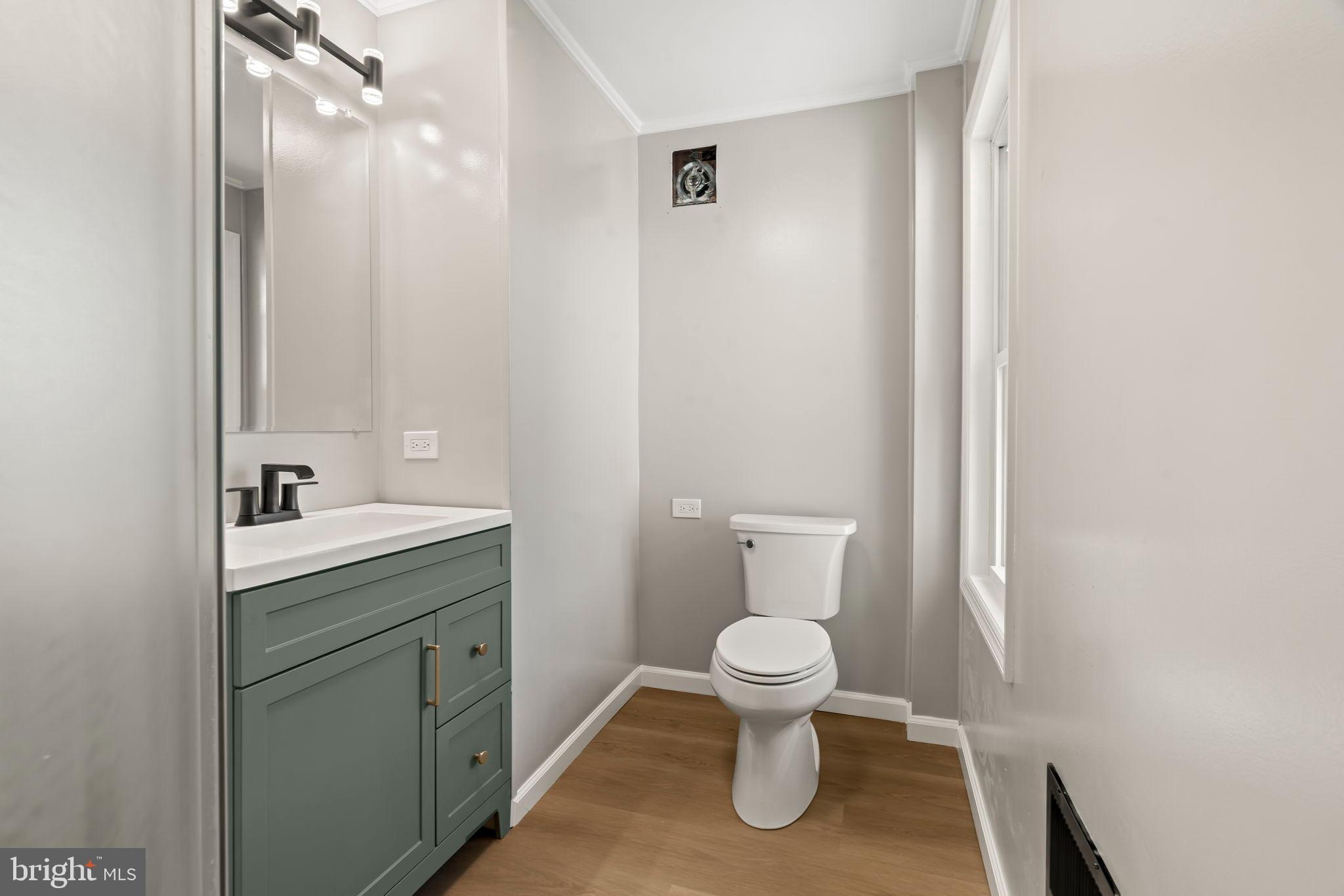 606 Spruce Street Delanco, NJ 08075 - Photo 22 of 29 a bathroom with a toilet sink and mirror