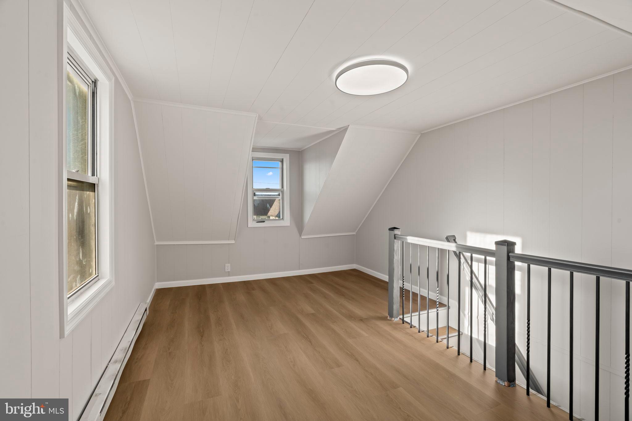 606 Spruce Street Delanco, NJ 08075 - Photo 25 of 29 a view of a livingroom with wooden floor and a window