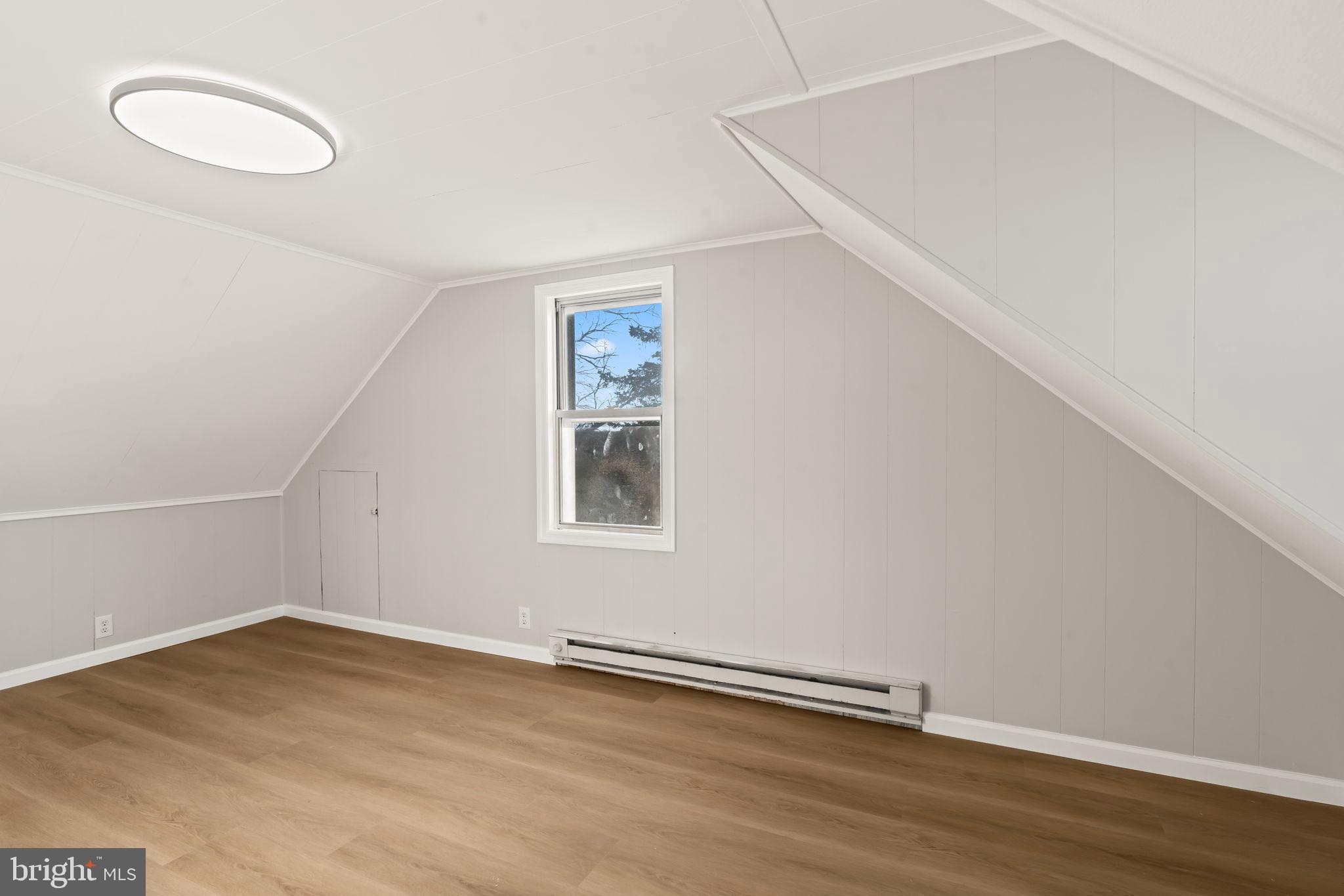 606 Spruce Street Delanco, NJ 08075 - Photo 26 of 29 an empty room with wooden floor and windows