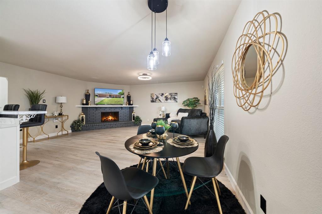 622 Roaming Rd Drive Allen, TX 75002 - Photo 11 of 27 a view of a dining room with furniture and wooden floor