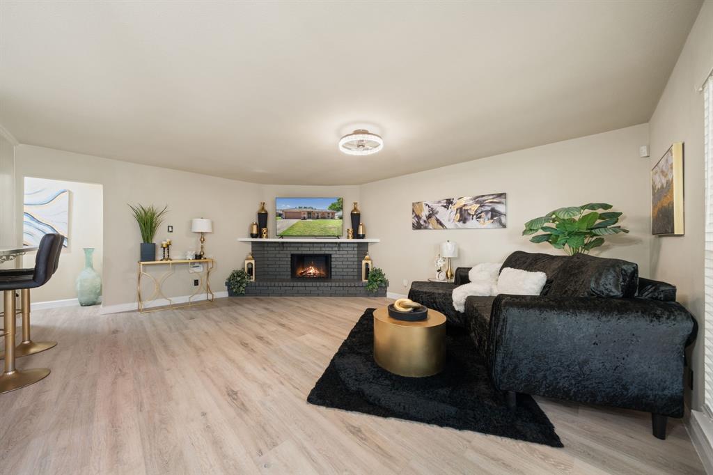 622 Roaming Rd Drive Allen, TX 75002 - Photo 14 of 27 a living room with furniture and a fireplace